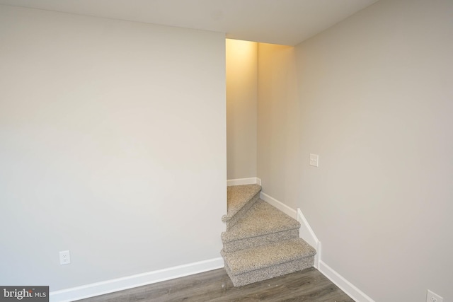 stairway featuring hardwood / wood-style floors