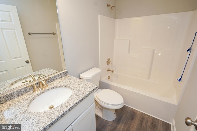 full bathroom featuring shower / bathing tub combination, vanity, wood-type flooring, and toilet