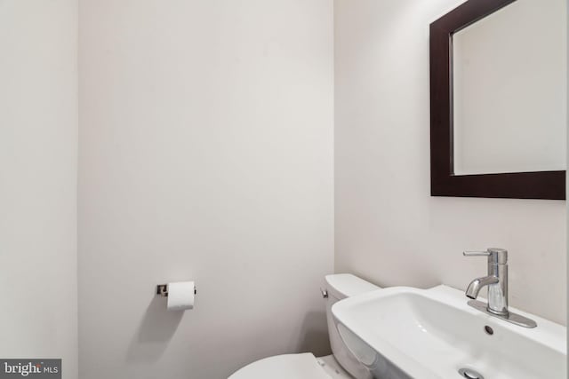 bathroom with sink and toilet