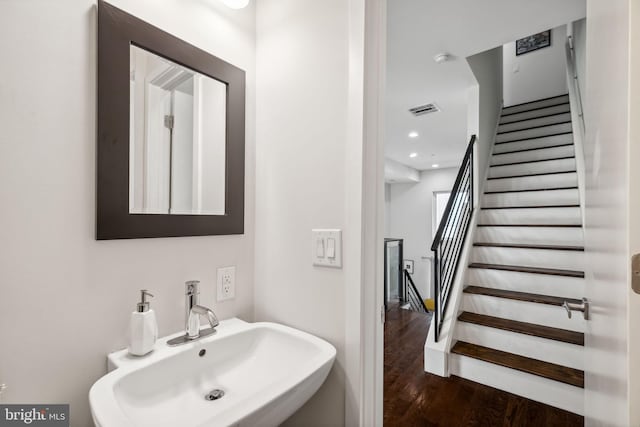 bathroom with wood-type flooring and sink