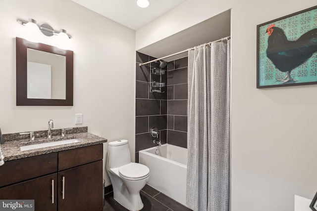 full bathroom with tile patterned floors, vanity, shower / tub combo with curtain, and toilet