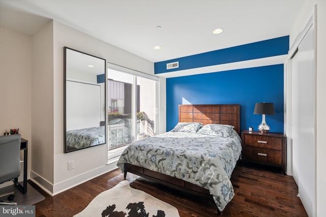 bedroom featuring dark hardwood / wood-style flooring