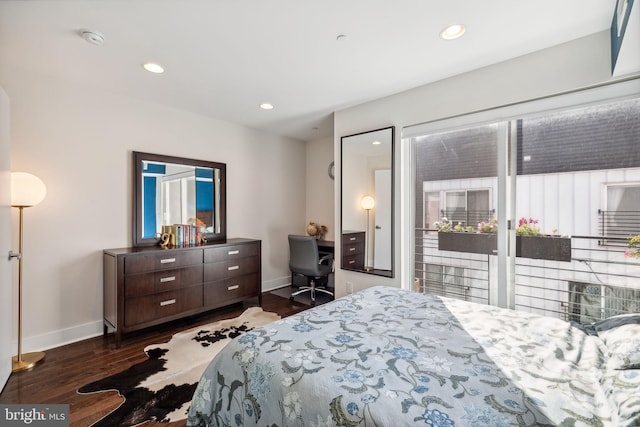 bedroom featuring access to outside and dark hardwood / wood-style floors