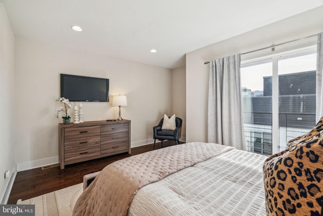 bedroom with dark wood-type flooring