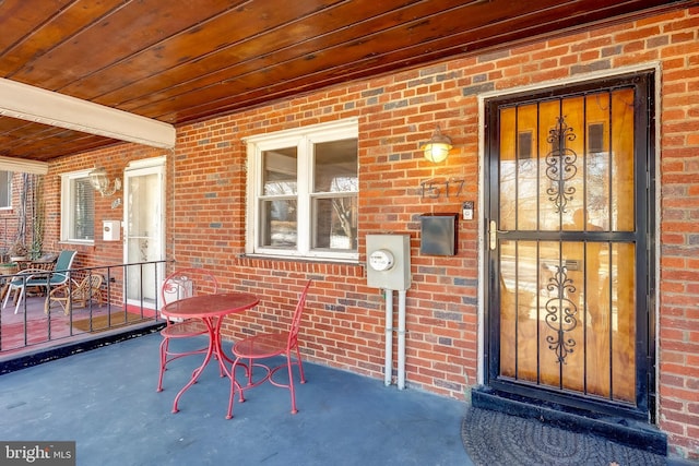 doorway to property featuring covered porch