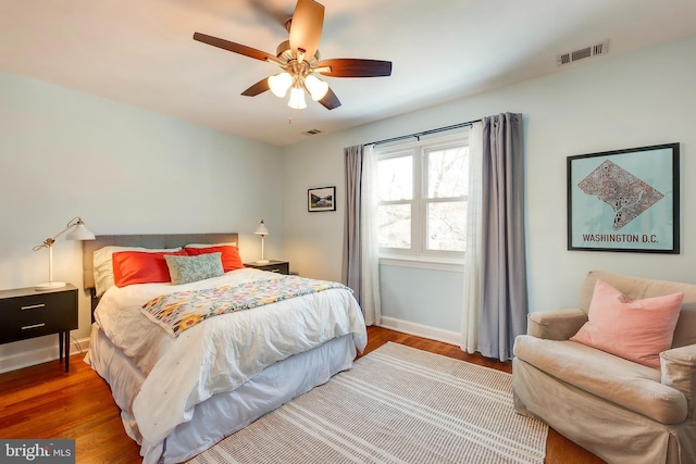 bedroom with hardwood / wood-style flooring and ceiling fan