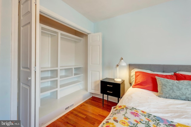 bedroom with hardwood / wood-style flooring