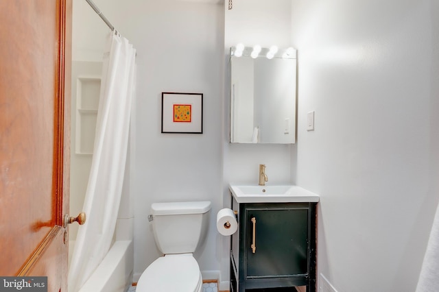 full bathroom featuring vanity, shower / tub combo, and toilet