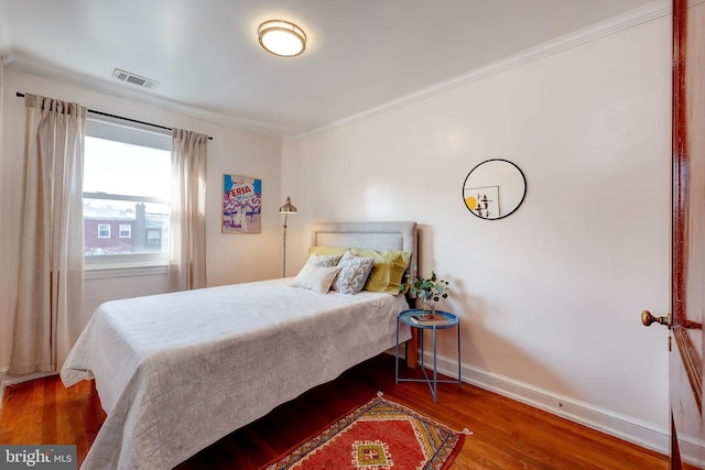 bedroom with hardwood / wood-style floors