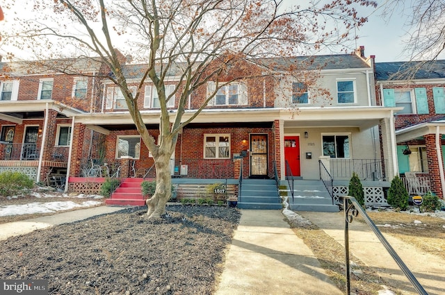 view of property featuring covered porch