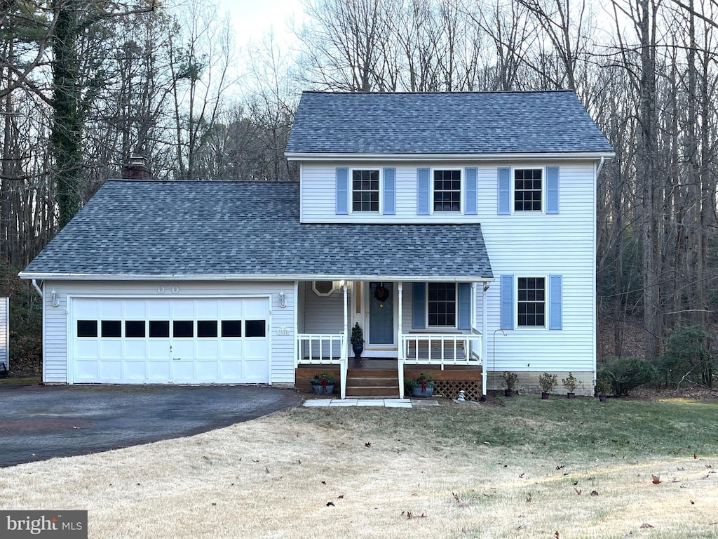 view of front of house featuring a garage and covered porch