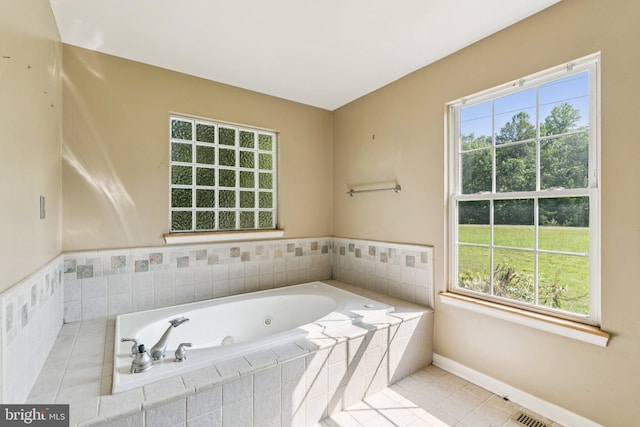14413 Bittersweet Dr, Hughesville, MD 20637 - bathroom with a tub with jets, baseboards, and healthy amount of natural light