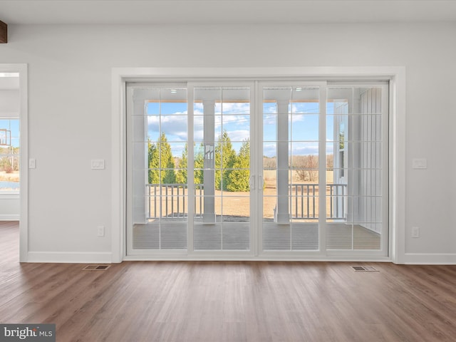 doorway to outside featuring hardwood / wood-style flooring