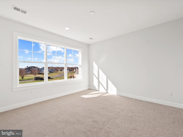 unfurnished room with carpet flooring