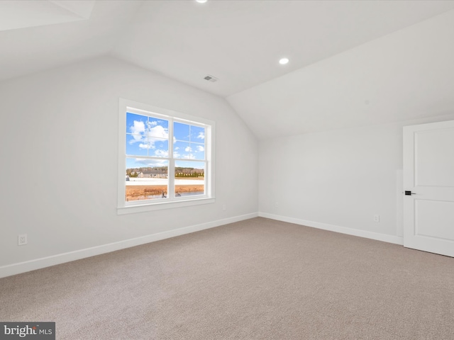 bonus room featuring carpet floors and lofted ceiling