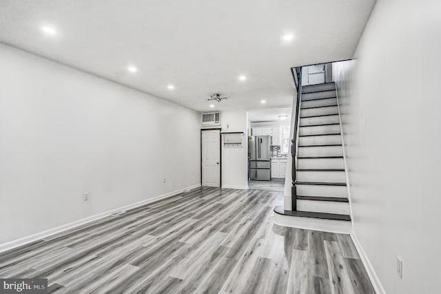 unfurnished living room featuring light wood-type flooring