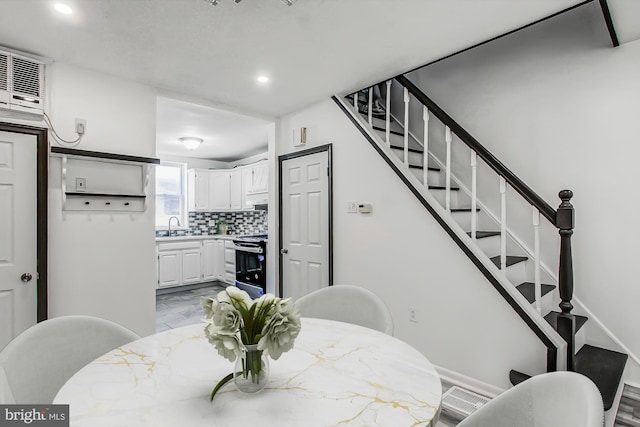 dining space featuring sink