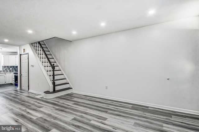 basement featuring light wood-type flooring