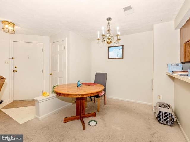 carpeted dining space with a notable chandelier