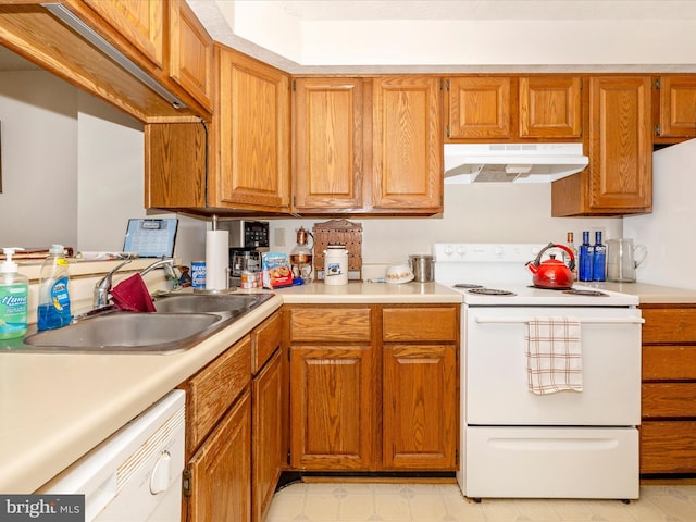 kitchen featuring sink and white appliances