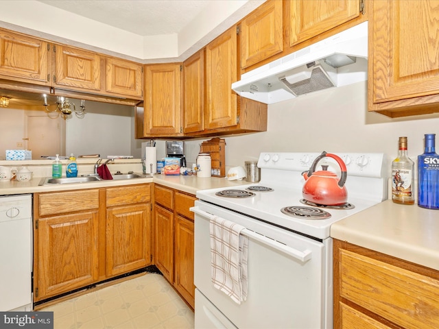 kitchen featuring sink and white appliances