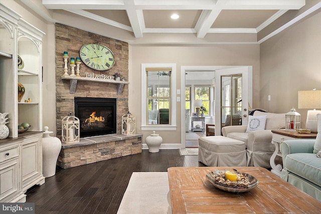 living room featuring coffered ceiling, beamed ceiling, dark hardwood / wood-style floors, a fireplace, and ornamental molding