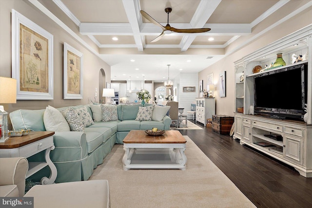 living room featuring beam ceiling, crown molding, coffered ceiling, and hardwood / wood-style flooring