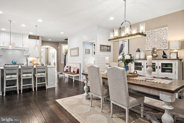 dining area with dark hardwood / wood-style flooring