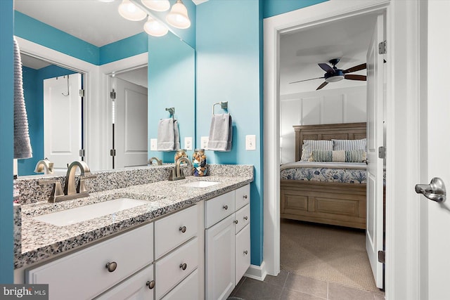 bathroom featuring tile patterned floors, ceiling fan, and vanity