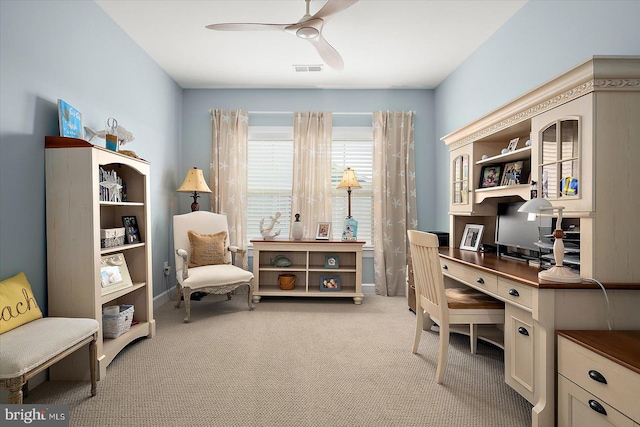 office featuring light carpet and ceiling fan