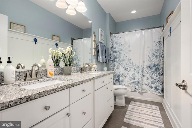 full bathroom with tile patterned floors, vanity, shower / bath combination with curtain, and toilet