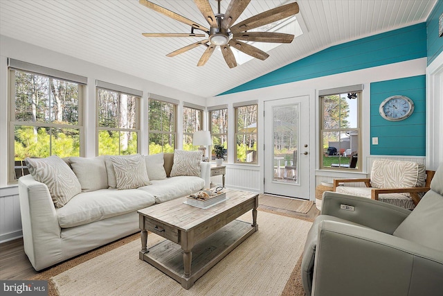 sunroom with wood ceiling, ceiling fan, lofted ceiling, and a wealth of natural light