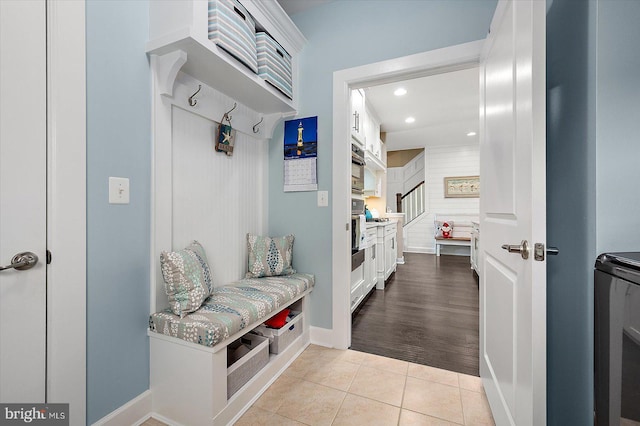 mudroom with light hardwood / wood-style flooring