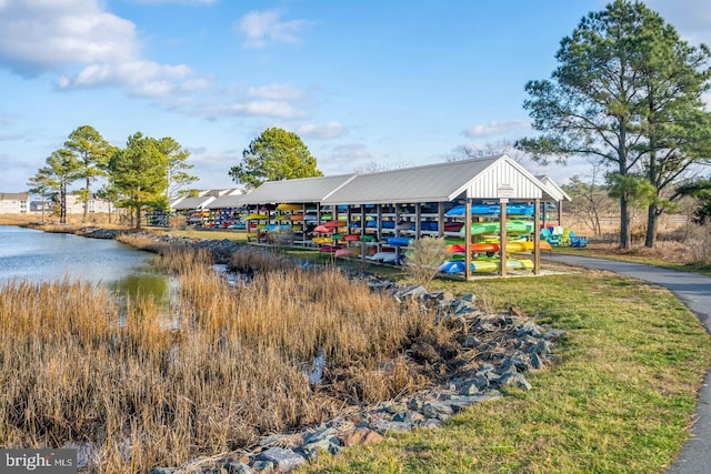 view of playground with a water view