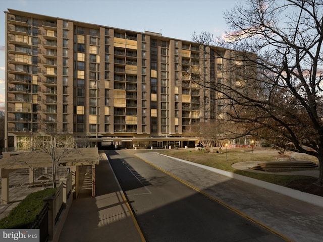 view of outdoor building at dusk