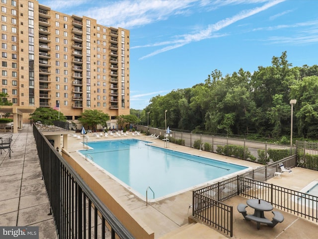 view of pool featuring a patio