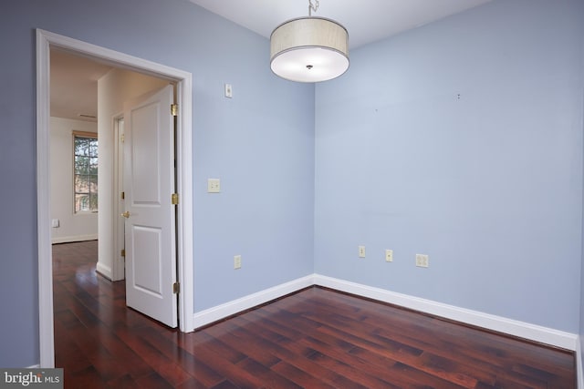 unfurnished room featuring dark hardwood / wood-style flooring