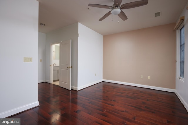 unfurnished room featuring dark hardwood / wood-style flooring and ceiling fan