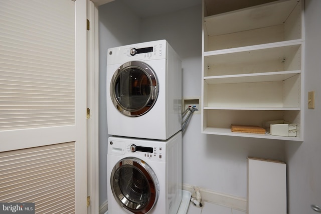 laundry room featuring stacked washer / dryer