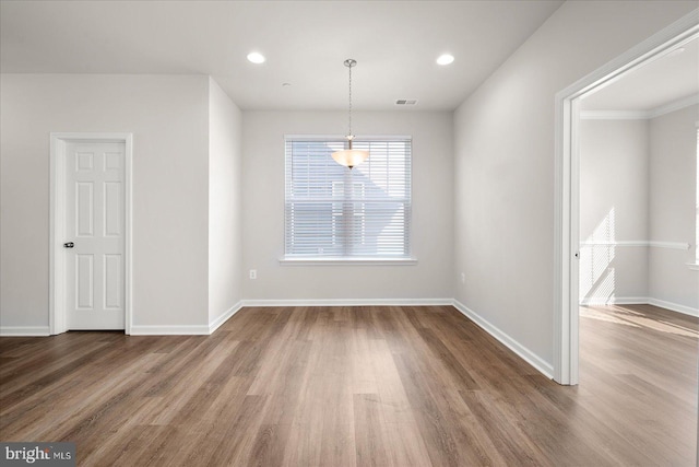 unfurnished room featuring hardwood / wood-style floors