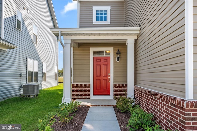 property entrance featuring central AC unit