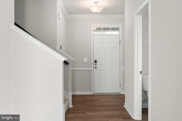 foyer with hardwood / wood-style floors and ornamental molding