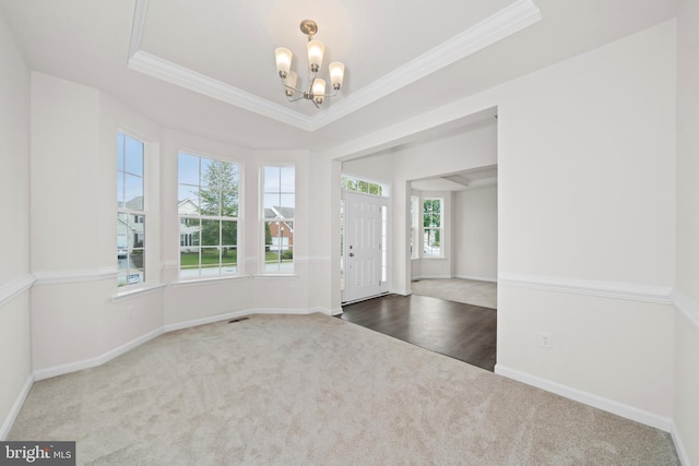 635 Corbit Dr, Middletown, DE 19709 - carpeted entrance foyer featuring a chandelier, ornamental molding, baseboards, and a tray ceiling