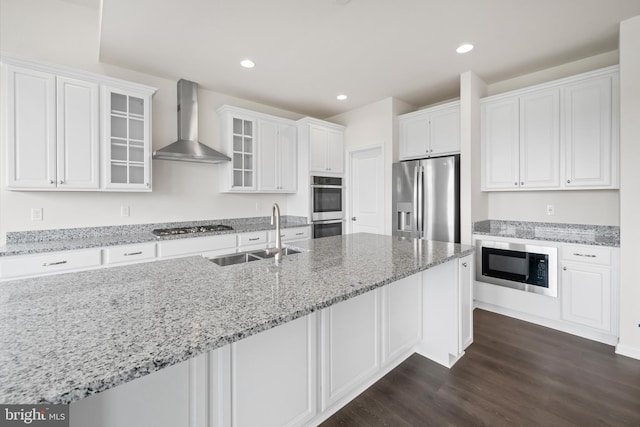 635 Corbit Dr, Middletown, DE 19709 - kitchen with wall chimney range hood, stainless steel appliances, a sink, white cabinetry, and dark wood finished floors