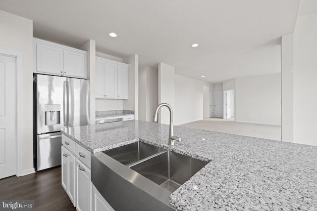 635 Corbit Dr, Middletown, DE 19709 - kitchen with stainless steel fridge with ice dispenser, a sink, white cabinets, light stone countertops, and recessed lighting
