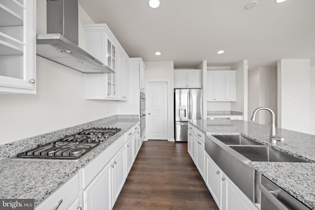 635 Corbit Dr, Middletown, DE 19709 - kitchen featuring wall chimney range hood, appliances with stainless steel finishes, a sink, recessed lighting, and white cabinets