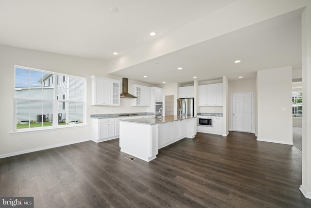635 Corbit Dr, Middletown, DE 19709 - kitchen featuring stainless steel appliances, wall chimney exhaust hood, dark wood-type flooring, healthy amount of natural light, and recessed lighting
