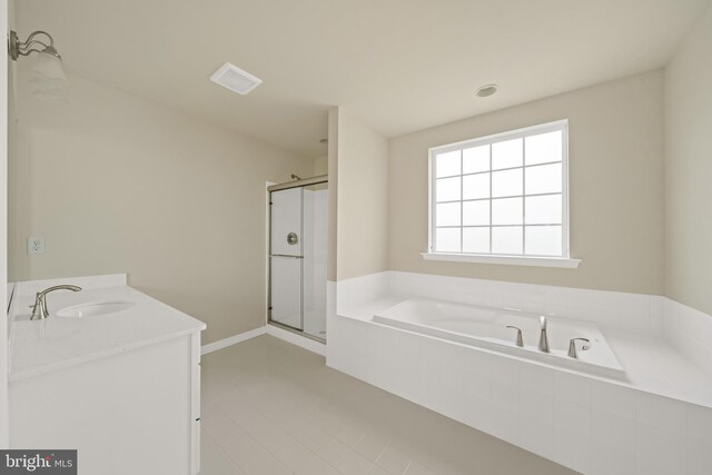 635 Corbit Dr, Middletown, DE 19709 - bathroom with a bath, a stall shower, tile patterned flooring, and vanity