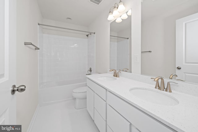 635 Corbit Dr, Middletown, DE 19709 - full bathroom featuring double vanity, tub / shower combination, toilet, and tile patterned flooring