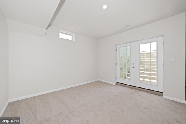 635 Corbit Dr, Middletown, DE 19709 - carpeted empty room with french doors and baseboards